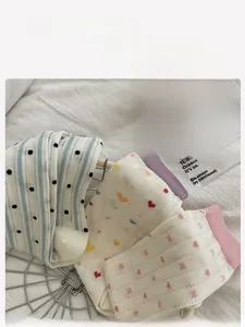 Detailed view of assorted soft cotton heart and striped socks in a stylish basket