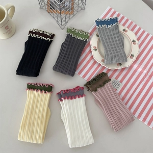 Six-pack of cotton crew socks with colorful ruffled edges and vertical ribbed texture