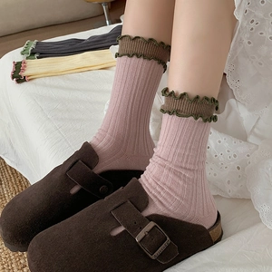 Pink rib-knit cotton crew socks with ruffles and stylish wave edge for women
