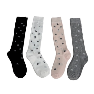 Four pack of breathable cotton calf socks with letter patterns in black, white, pink and gray
