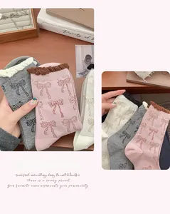 Detail of sweet knit socks with bow patterns and wavy ruffled edges in various colors