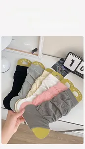 Detail showing various colors of pleated mesh leg warmers in a fan-shaped arrangement