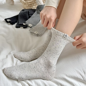 Women's Japanese style knit crew socks with snowflake flecks and dog love patch label