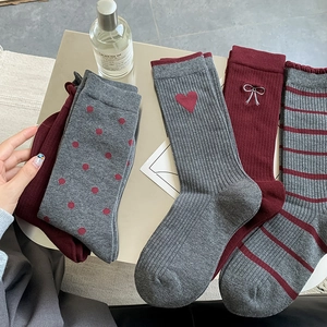Set of four knitted mid-calf socks with heart and bow embroidery in grey and burgundy