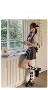 Close-up of black and white argyle pattern on knitted knee-high socks for JK style