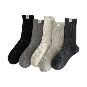 Five-pack of ribbed knit crew socks with colorful speckled patterns and dog love labels