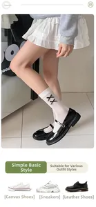 White crew socks featuring black bow ties styled with black Mary Jane shoes for JK uniform look