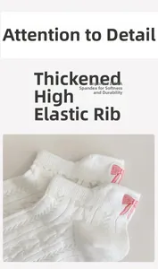 Close-up of white mesh socks with pink bow embroidery and elastic Lycra cuffs