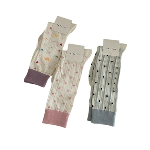 Three-pack cotton crew socks for women featuring colorful hearts and polka dot patterns