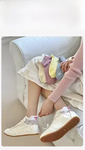 Detail of sweet cotton mesh socks with pink bow embroidery in various macaron colors
