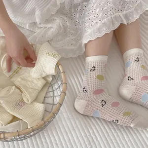 Mesh breathable mid-tube crew socks with cute smiley faces and colorful polka dots