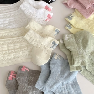 Pastel rib-knit cotton crew socks set featuring embroidered bows and wavy cuffs