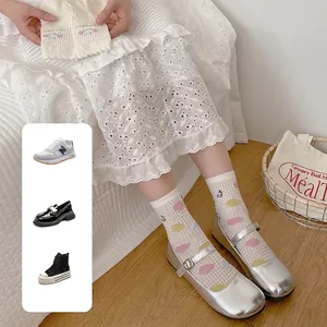 Breathable white mesh mid-calf socks with rainbow polka dots and cute smiley design