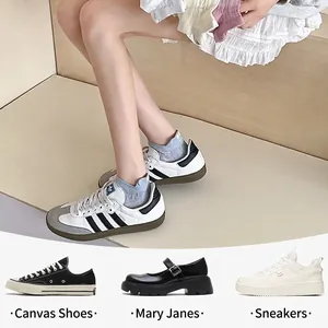 Light gray bow mesh socks with heel embroidery shown with sneakers and canvas shoes