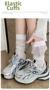 Detail of elastic cuff on mesh bow socks for women showing breathable knit and stretch