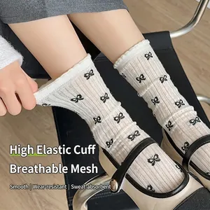 Japanese style breathable mesh crew socks with bow pattern and ruffled edge in cream white