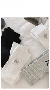 Detailed embroidery bow on rib-knit cotton calf socks in classic white, black and grey