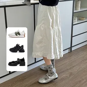 Japanese style grey mesh socks with black bow pattern and silver Mary Jane shoes