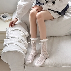 White mesh knee-high socks with delicate lace ruffles and silk ribbons for women