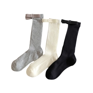 Three-pack cotton crew socks in white, black and grey with silk ribbon bow accents