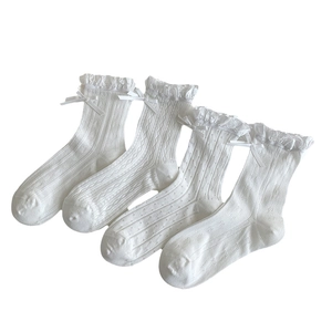 White JK style mesh socks with sweet lace edges and ribbon bows in a four-pair set display