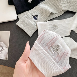 Breathable white ribbed crew socks for women featuring delicate beetle embroidery details
