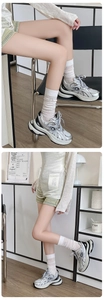 Silver metallic chunky dad sneakers with mesh panels and thick platform soles