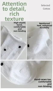 Close-up of white polka dot cotton mesh socks with reinforced heel and smooth toe seam