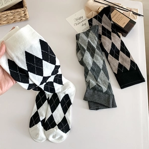 Classic British style argyle knit knee-high socks in assorted colors with elastic cuffs
