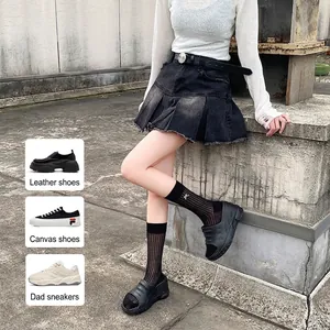 White mid-calf cotton socks with bee embroidery and bow details in a street style