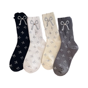 Mid-calf women socks in 4 colors featuring white bow patterns and rhinestone accents