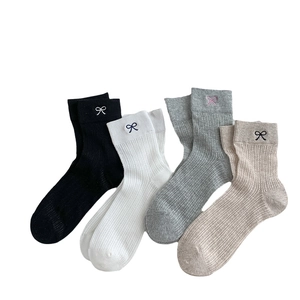 Women's mesh mid-calf socks with embroidered bows in black, white, gray, and brown