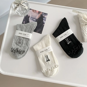 Trio of ruffled cotton crew socks with bow embroidery in black, white, and grey colors