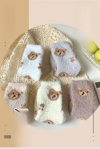 Set of five plush coral fleece socks featuring cute bear embroidery in soft pastel tones