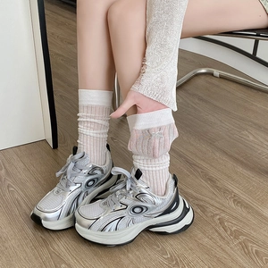 Breathable white mesh calf socks with bow embroidery styled with silver platform sneakers
