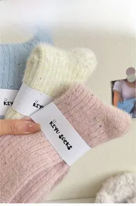 Close-up of colorful thick thermal socks with fleece texture and speckled yarn detail