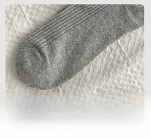 Close-up of flat-seam toe and fine vertical ribbed texture on gray cotton socks