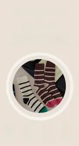 Detail of striped cotton crew socks featuring warm ribbed texture and reinforced color-block toes