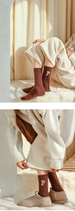 Detailed embroidery of letter P on thick dark brown cashmere blend winter socks