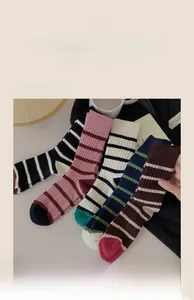Close-up of five pairs of striped knit cotton crew socks in vintage Japanese style