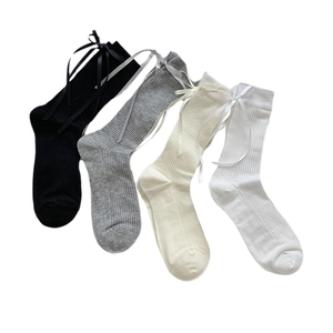 Set of mesh cotton socks with ribbon bows in black, grey, beige and white colors