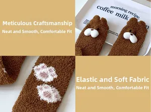 Close-up of thick coral fleece winter socks with cartoon bear ears and pink paw prints