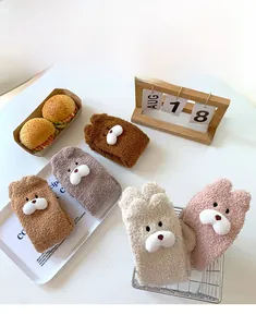 Detail of coral fleece thick socks with cute 3D bear ears and cartoon faces