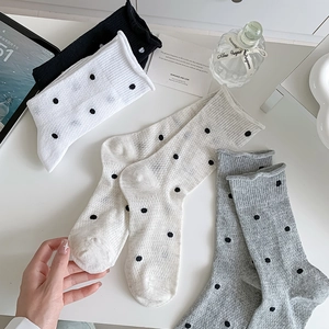 Polka dot crew socks for women in black white and grey with trendy rolled cuffs and soft knit