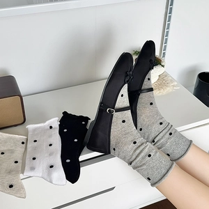 Polka dot crew socks for women, gray cotton mesh design styled with Mary Jane shoes