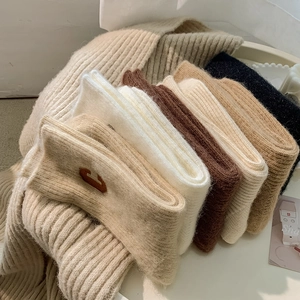 Thick wool socks with C-letter embroidery in neutral colors for winter warmth