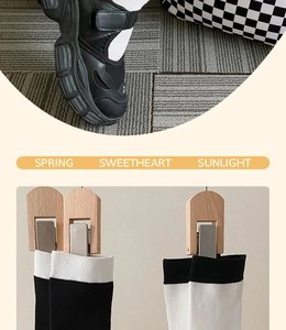 Detail of minimalist cotton crew socks with contrast trim worn with platform sandals