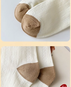 Close-up of cotton sock with khaki color blocking and wave knit pattern texture