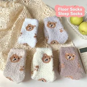 Five pairs of coral fleece socks with cute bear patterns in various warm winter colors