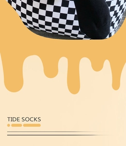 Detailed view of black and white checkerboard pattern socks with solid black toe patches